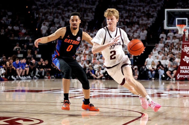 Jan 18, 2023; College Station, Texas, USA; Texas A&M Aggies guard Hayden Hefner (2) drives to the basket while Florida Gators guard Myreon Jones (0) defends during the second half at Reed Arena. Mandatory Credit: Erik Williams-USA TODAY Sports
