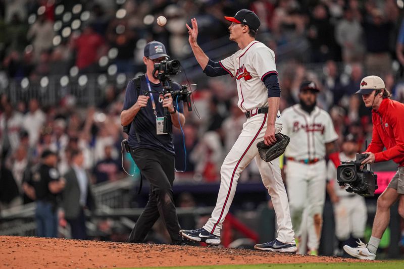 Apr 23, 2024; Cumberland, Georgia, USA; Atlanta Braves pitcher Max Fried (54) reacts on the field after pitching a complete game shutout against the Miami Marlins at Truist Park. Mandatory Credit: Dale Zanine-USA TODAY Sports