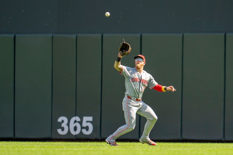Sep 15, 2024; Minneapolis, Minnesota, USA; Cincinnati Reds right fielder Jake Fraley (27) catches a fly ball against the Minnesota Twins in the fifth inning at Target Field. Mandatory Credit: Jesse Johnson-Imagn Images