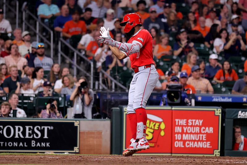 May 20, 2024; Houston, Texas, USA; Los Angeles Angels right fielder Jo Adell (7) crosses home plate after hitting a three-run home run against the Houston Astros during the fifth inning at Minute Maid Park. Mandatory Credit: Erik Williams-USA TODAY Sports