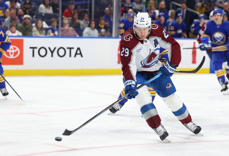 Oct 13, 2025; Buffalo, New York, USA;  Colorado Avalanche center Nathan MacKinnon (29) takes a shot on goal and scores during the first period against the Buffalo Sabres at KeyBank Center. Mandatory Credit: Timothy T. Ludwig-Imagn Images