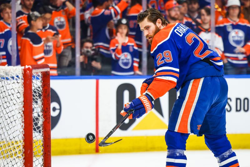 Jun 21, 2024; Edmonton, Alberta, CAN; Edmonton Oilers center Leon Draisaitl (29) shoots the puck during the warmup period against the Florida Panthers in game six of the 2024 Stanley Cup Final at Rogers Place. Mandatory Credit: Sergei Belski-USA TODAY Sports