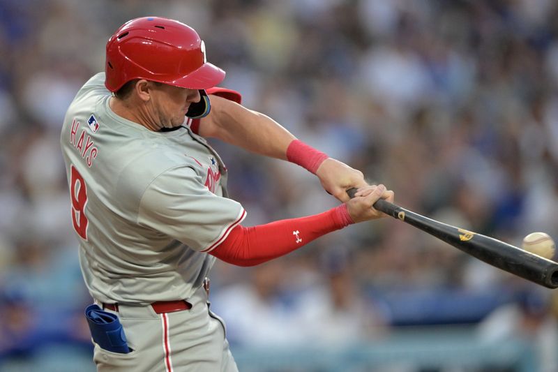 Aug 5, 2024; Los Angeles, California, USA;  Philadelphia Phillies left fielder Austin Hays (9) singles in a run in the second inning against the Los Angeles Dodgers at Dodger Stadium. Mandatory Credit: Jayne Kamin-Oncea-USA TODAY Sports