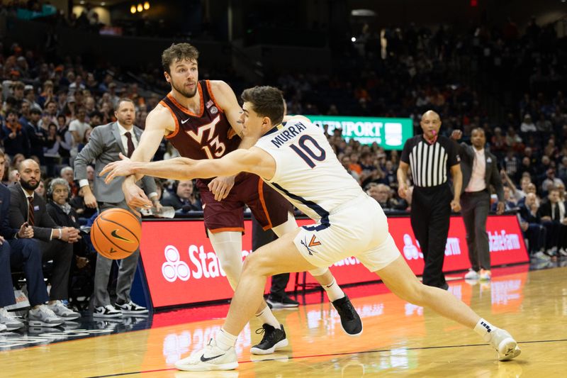 Feb 1, 2025; Charlottesville, Virginia, USA; Virginia Tech Hokies forward Ben Burnham (13) passes the ball as Virginia Cavaliers guard Taine Murray (10) defends in the second half at John Paul Jones Arena. Mandatory Credit: Emily Morgan-Imagn Images