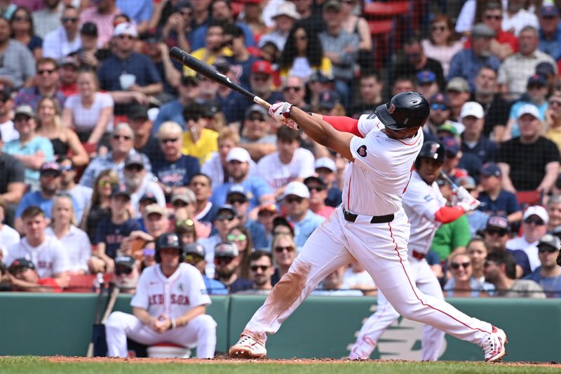 Jun 2, 2024; Boston, Massachusetts, USA;  Boston Red Sox third baseman Rafael Devers (11) hits a home run against the Detroit Tigers during the eighth inning at Fenway Park. Mandatory Credit: Eric Canha-USA TODAY Sports