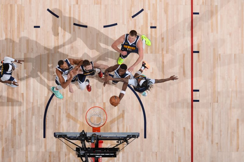 DENVER, CO - APRIL 10: Anthony Edwards #5 of the Minnesota Timberwolves shoots the ball during the game against the Denver Nuggets on April 10, 2024 at the Ball Arena in Denver, Colorado. NOTE TO USER: User expressly acknowledges and agrees that, by downloading and/or using this Photograph, user is consenting to the terms and conditions of the Getty Images License Agreement. Mandatory Copyright Notice: Copyright 2024 NBAE (Photo by Bart Young/NBAE via Getty Images)