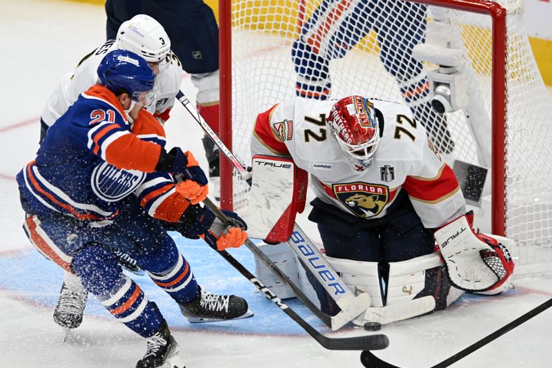Jun 6, 2025; Edmonton, Alberta, CAN; Edmonton Oilers center Trent Frederic (21) shoots on Florida Panthers goaltender Sergei Bobrovsky (72) during overtime in game two of the 2025 Stanley Cup Final at Rogers Place. Mandatory Credit: Walter Tychnowicz-Imagn Images