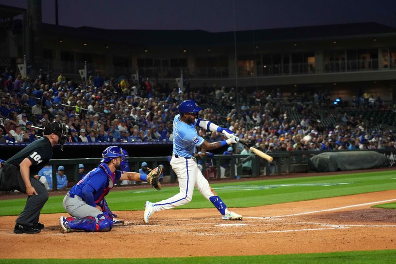 Mar 5, 2024; Surprise, Arizona, USA; Kansas City Royals third baseman Maikel Garcia (11) bats against the Chicago Cubs during the third inning at Surprise Stadium. Mandatory Credit: Joe Camporeale-USA TODAY Sports