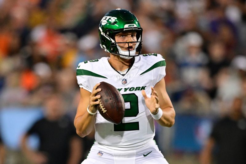 New York Jets quarterback Zach Wilson looks to pass during the first half against the Cleveland Browns in the Hall of Fame NFL football preseason game Thursday, Aug. 3, 2023, in Canton, Ohio. (AP Photo/David Dermer)