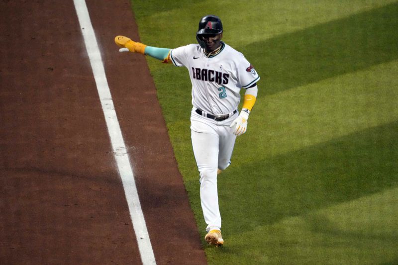 Jun 18, 2023; Phoenix, Arizona, USA; Arizona Diamondbacks shortstop Geraldo Perdomo (2) scores a run against the Cleveland Guardians during the fifth inning at Chase Field. Mandatory Credit: Joe Camporeale-USA TODAY Sports