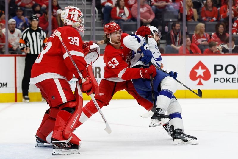 Jan 25, 2025; Detroit, Michigan, USA;  Detroit Red Wings defenseman Moritz Seider (53) and Tampa Bay Lightning left wing Nick Paul (20) fight for position in front of goaltender Cam Talbot (39) in the third period at Little Caesars Arena. Mandatory Credit: Rick Osentoski-Imagn Images