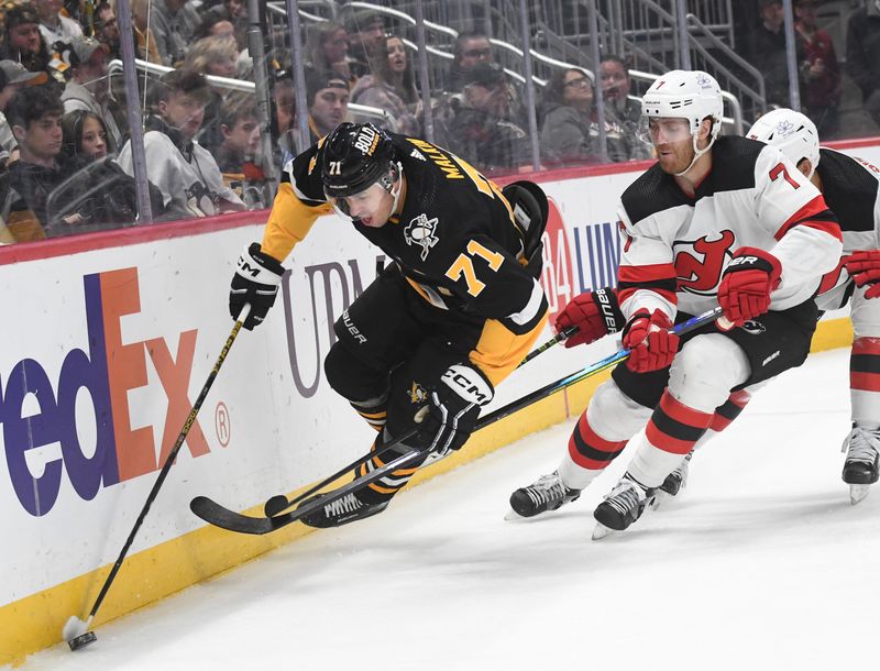 Nov 16, 2023; Pittsburgh, Pennsylvania, USA; Pittsburgh Penguins center Evgeni Malkin (71) is tripped by New Jersey Devils defenseman Dougie Hamilton (7) during the third period at PPG Paints Arena. The Devils won 5-2. Mandatory Credit: Philip G. Pavely-USA TODAY Sports