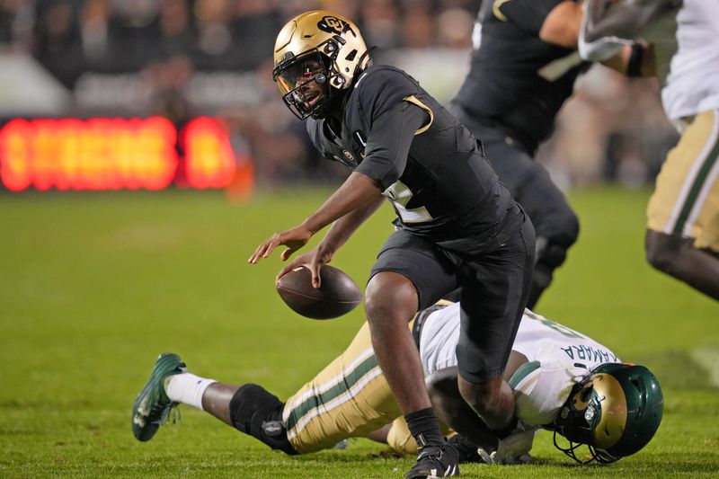 Sep 16, 2023; Boulder, Colorado, USA; Colorado State Rams defensive lineman Mohamed Kamara (8) sacks Colorado Buffaloes quarterback Shedeur Sanders (2) during the first half at Folsom Field. Mandatory Credit: Andrew Wevers-USA TODAY Sports