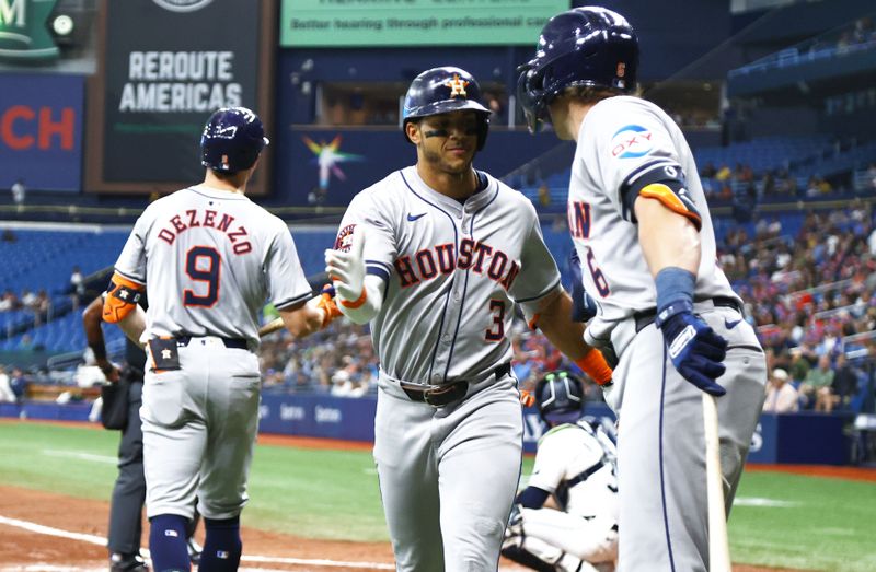 Aug 14, 2024; St. Petersburg, Florida, USA; Houston Astros shortstop Jeremy Pena (3) celebrates with outfielder Jake Meyers (6) after he hit a home run against the Tampa Bay Rays during the fifth inning during the fifth inning at Tropicana Field. Mandatory Credit: Kim Klement Neitzel-USA TODAY Sports