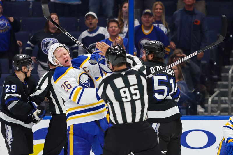 Feb 28, 2026; Tampa, Florida, USA; Tampa Bay Lightning defenseman Charle-Edouard D'Astous (51) punches Buffalo Sabres defenseman Rasmus Dahlin (26) after the game at Benchmark International Arena. Mandatory Credit: Morgan Tencza-Imagn Images