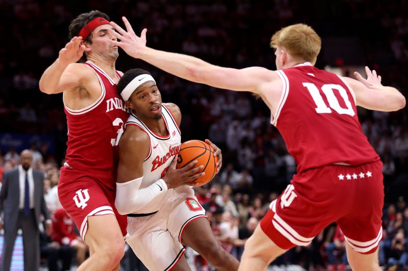 Jan 17, 2025; Columbus, Ohio, USA; Ohio State Buckeyes guard Micah Parrish (8) drives to the basket as Indiana Hoosiers guard Trey Galloway (32) and Indiana Hoosiers forward Luke Goode (10) defend during the second half at Value City Arena. Mandatory Credit: Joseph Maiorana-Imagn Images