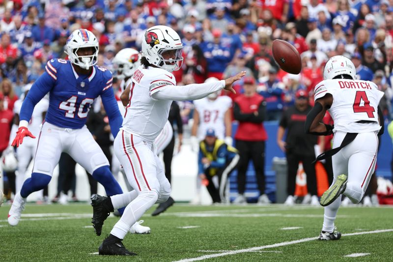 Arizona Cardinals quarterback Kyler Murray tosses the ball on a running play against the Buffalo Bills during the first half of an NFL football game Sunday, Sept. 8, 2024, in Orchard Park, N.Y. (AP Photo/Jeff T. Barnes)