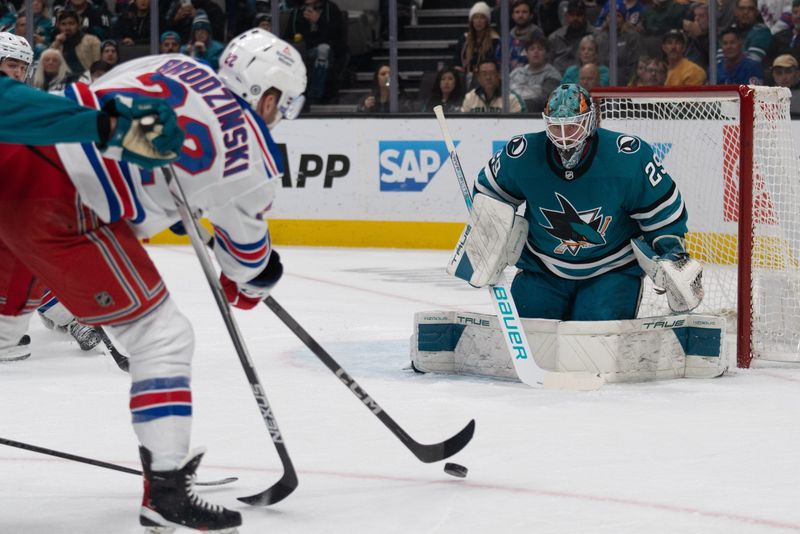 Jan 23, 2024; San Jose, California, USA; New York Rangers center Jonny Brodzinski (22) shoots the puck during the first period against San Jose Sharks goaltender Mackenzie Blackwood (29) at SAP Center at San Jose. Mandatory Credit: Stan Szeto-USA TODAY Sports