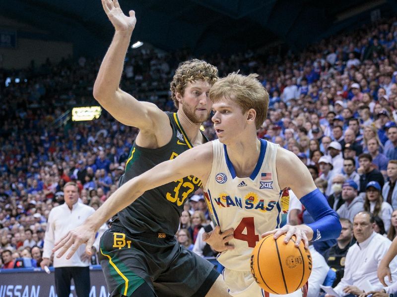 Feb 18, 2023; Lawrence, Kansas, USA; Kansas Jayhawks guard Gradey Dick (4) drives around Baylor Bears forward Caleb Lohner (33) during the second half at Allen Fieldhouse. Mandatory Credit: William Purnell-USA TODAY Sports