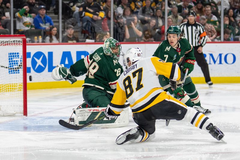 Feb 9, 2024; Saint Paul, Minnesota, USA; Pittsburgh Penguins center Sidney Crosby (87) shoots past Minnesota Wild goaltender Marc-Andre Fleury (29) scoring in the third period at Xcel Energy Center. Mandatory Credit: Matt Blewett-USA TODAY Sports