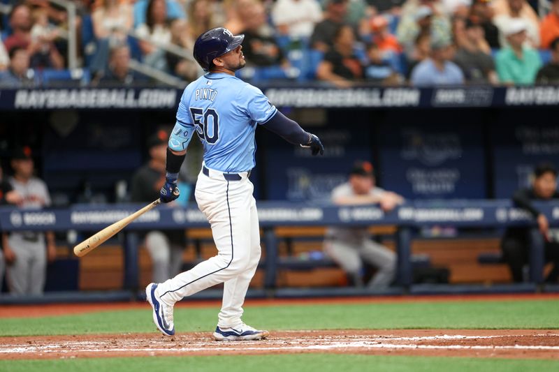 Apr 14, 2024; St. Petersburg, Florida, USA;  Tampa Bay Rays catcher René Pinto (50) hits a three run home run against the San Francisco Giants in the fourth inning at Tropicana Field. Mandatory Credit: Nathan Ray Seebeck-USA TODAY Sports