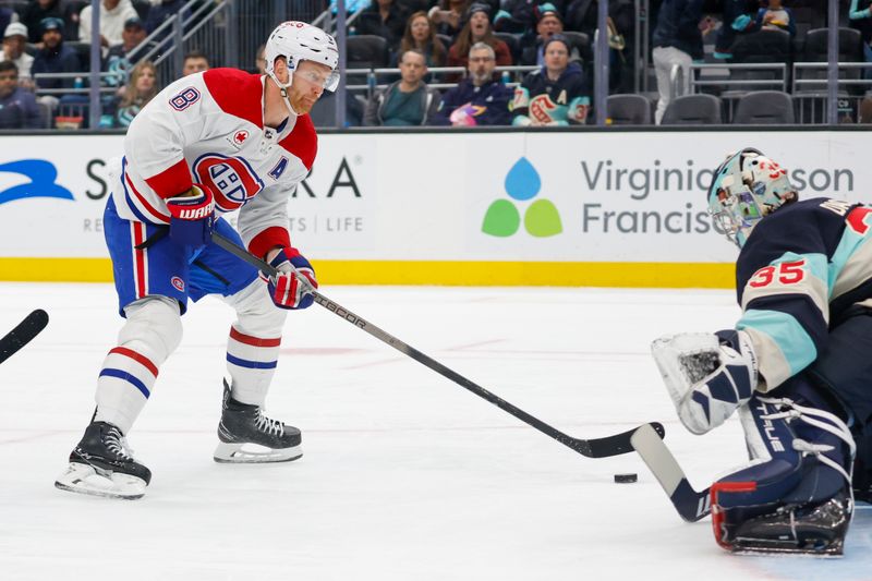 Mar 24, 2024; Seattle, Washington, USA; Montreal Canadiens defenseman Mike Matheson (8) scores a goal against Seattle Kraken goaltender Joey Daccord (35)  during the second period at Climate Pledge Arena. Mandatory Credit: Joe Nicholson-USA TODAY Sports