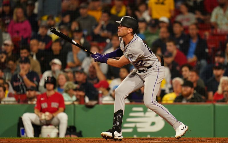 Jun 14, 2023; Boston, Massachusetts, USA; Colorado Rockies first baseman Nolan Jones (22) gets a hit against the Boston Red Sox in the sixth inning at Fenway Park. Mandatory Credit: David Butler II-USA TODAY Sports