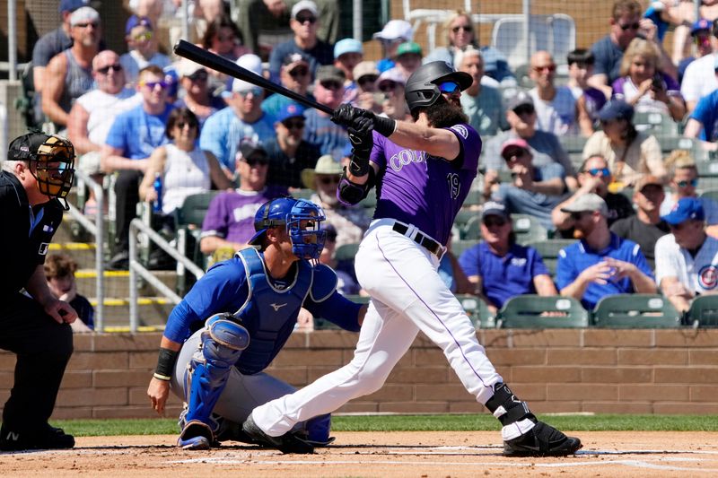 Mar 21, 2024; Salt River Pima-Maricopa, Arizona, USA; Colorado Rockies designated hitter Charlie Blackmon (19) hits against the Chicago Cubs in the first inning at Salt River Fields at Talking Stick. Mandatory Credit: Rick Scuteri-USA TODAY Sports