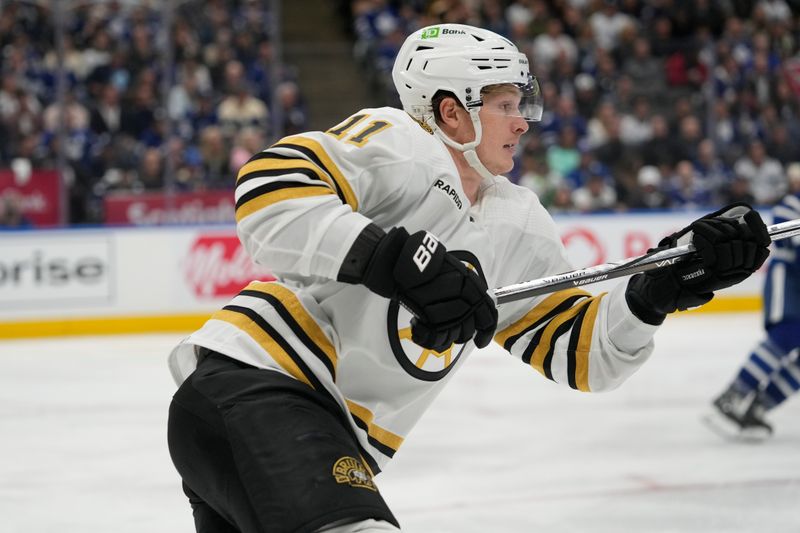 Apr 24, 2024; Toronto, Ontario, CAN; Boston Bruins forward Trent Frederic (11) skates against the Toronto Maple Leafs during the third period of game three of the first round of the 2024 Stanley Cup Playoffs at Scotiabank Arena. Mandatory Credit: John E. Sokolowski-USA TODAY Sports