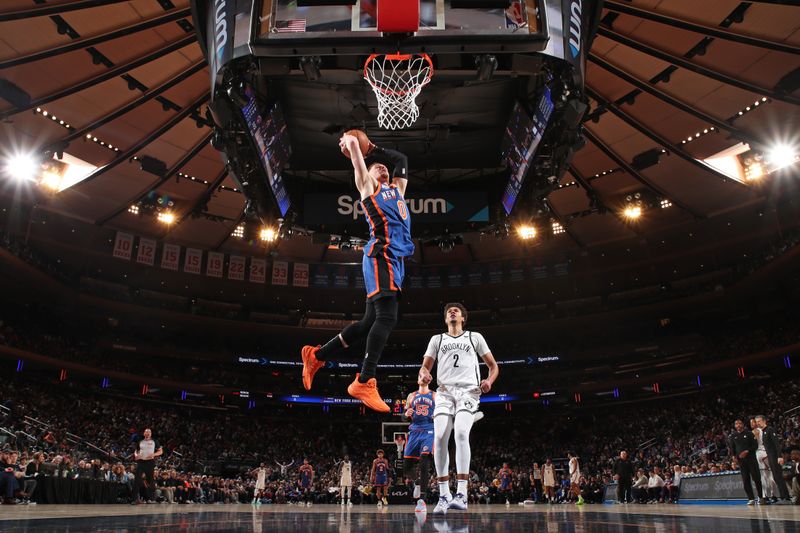 NEW YORK, NY - MARCH 23: Donte Divincenzo #0 of the New York Knicks dunks the ball during the game against the Brooklyn Nets on March 23, 2024 at Madison Square Garden in New York City, New York.  NOTE TO USER: User expressly acknowledges and agrees that, by downloading and or using this photograph, User is consenting to the terms and conditions of the Getty Images License Agreement. Mandatory Copyright Notice: Copyright 2024 NBAE  (Photo by Nathaniel S. Butler/NBAE via Getty Images)