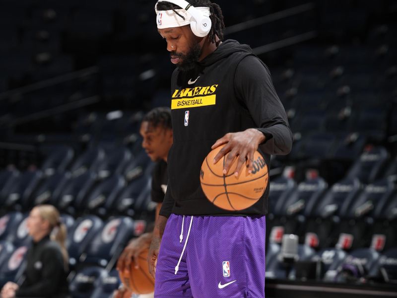 MINNEAPOLIS, MN -  OCTOBER 28: Patrick Beverly #21 of the Los Angeles Lakers warms up before the game against the Minnesota Timberwolves on October 28, 2022 at Target Center in Minneapolis, Minnesota. NOTE TO USER: User expressly acknowledges and agrees that, by downloading and or using this Photograph, user is consenting to the terms and conditions of the Getty Images License Agreement. Mandatory Copyright Notice: Copyright 2022 NBAE (Photo by David Sherman/NBAE via Getty Images)