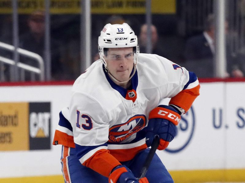 Feb 20, 2024; Pittsburgh, Pennsylvania, USA; New York Islanders center Mathew Barzal (13) breaks up ice with the puck against the Pittsburgh Penguins during the second period at PPG Paints Arena. Mandatory Credit: Charles LeClaire-USA TODAY Sports