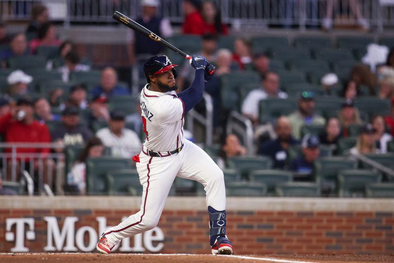 Apr 10, 2025; Atlanta, Georgia, USA; Atlanta Braves left fielder Bryan De La Cruz (14) hits a double against the Philadelphia Phillies in the second inning at Truist Park. Mandatory Credit: Brett Davis-Imagn Images
