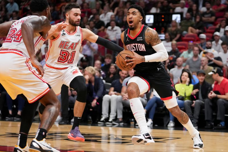 MIAMI, FLORIDA - FEBRUARY 10: Kenyon Martin Jr. #6 of the Houston Rockets drives to the basket while being defended by Max Strus #31 of the Miami Heat during the first half at Miami-Dade Arena on February 10, 2023 in Miami, Florida. NOTE TO USER: User expressly acknowledges and agrees that,? by downloading and or using this photograph,? User is consenting to the terms and conditions of the Getty Images License Agreement. (Photo by Eric Espada/Getty Images)