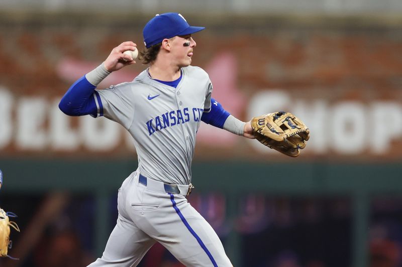 Sep 27, 2024; Atlanta, Georgia, USA; Kansas City Royals shortstop Bobby Witt Jr. (7) throws a runner out at first against the Atlanta Braves in the fourth inning at Truist Park. Mandatory Credit: Brett Davis-Imagn Images