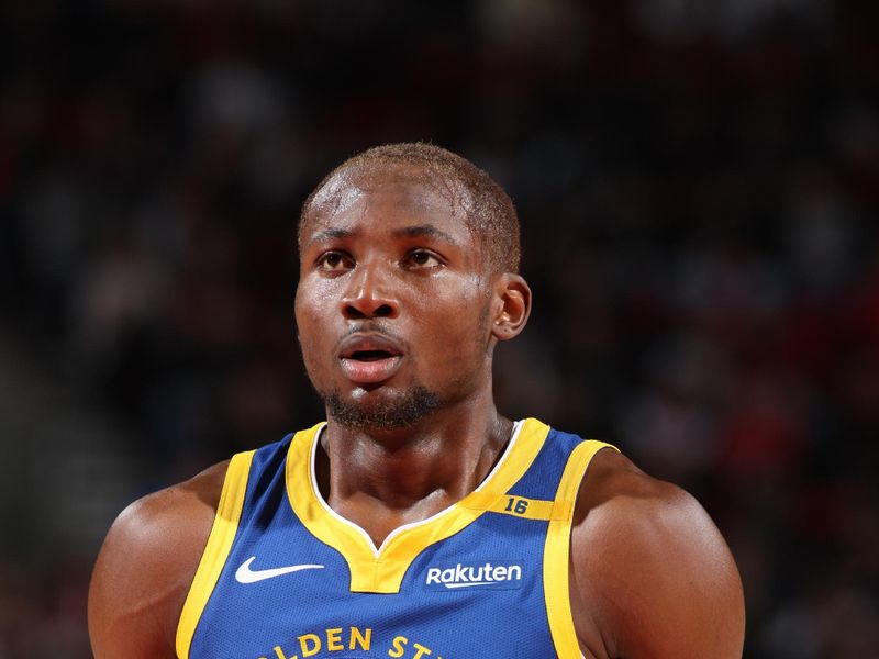 PORTLAND, OR - OCTOBER 23: Jonathan Kuminga #00 of the Golden State Warriors shoots a free throw during the game against the Portland Trail Blazers on October 23, 2024 at the Moda Center Arena in Portland, Oregon. NOTE TO USER: User expressly acknowledges and agrees that, by downloading and or using this photograph, user is consenting to the terms and conditions of the Getty Images License Agreement. Mandatory Copyright Notice: Copyright 2024 NBAE (Photo by Cameron Browne/NBAE via Getty Images)