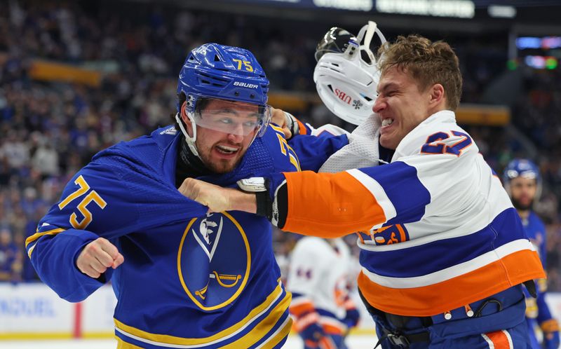 Mar 14, 2024; Buffalo, New York, USA;  Buffalo Sabres defenseman Connor Clifton (75) and New York Islanders left wing Anders Lee (27) fight during the third period at KeyBank Center. Mandatory Credit: Timothy T. Ludwig-USA TODAY Sports