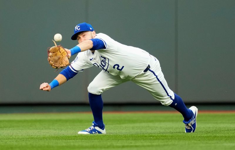 Apr 22, 2024; Kansas City, Missouri, USA; Kansas City Royals center fielder Garrett Hampson (2) dives for a catch during the second inning against the Toronto Blue Jays at Kauffman Stadium. Mandatory Credit: Jay Biggerstaff-USA TODAY Sports