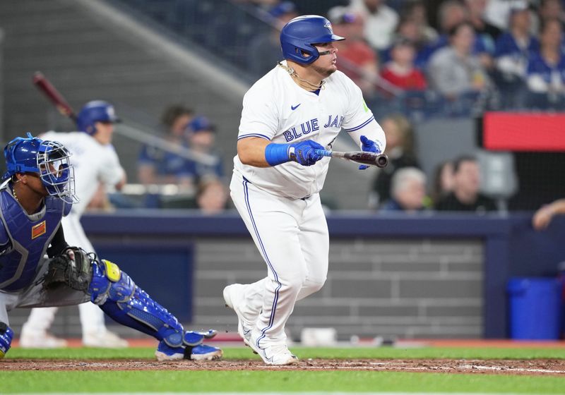 May 1, 2024; Toronto, Ontario, CAN; Toronto Blue Jays designated hitter Daniel Vogelbach (20) hits a double against the Kansas City Royals during the ninth inning at Rogers Centre. Mandatory Credit: Nick Turchiaro-USA TODAY Sports