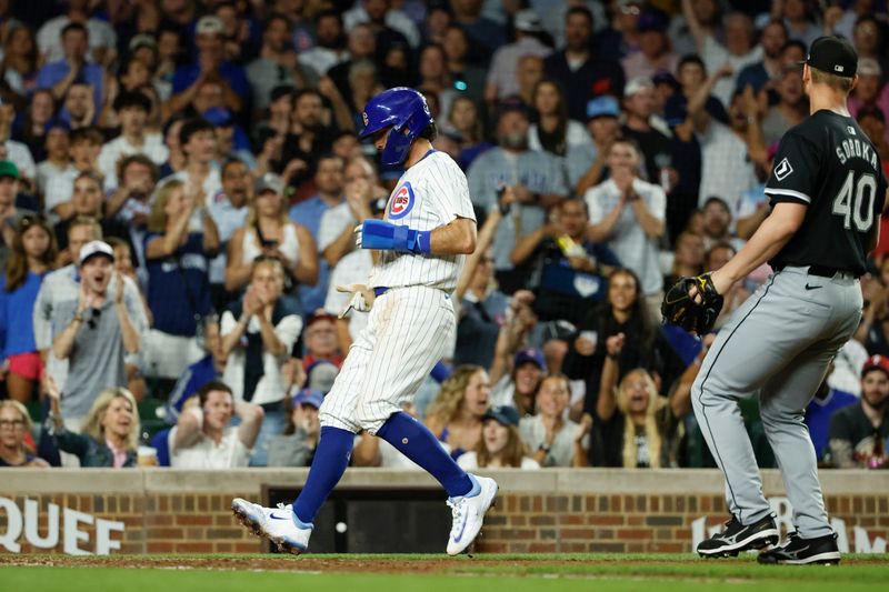 Jun 5, 2024; Chicago, Illinois, USA; Chicago Cubs shortstop Dansby Swanson (7) scores against the Chicago White Sox during the seventh inning at Wrigley Field. Mandatory Credit: Kamil Krzaczynski-USA TODAY Sports