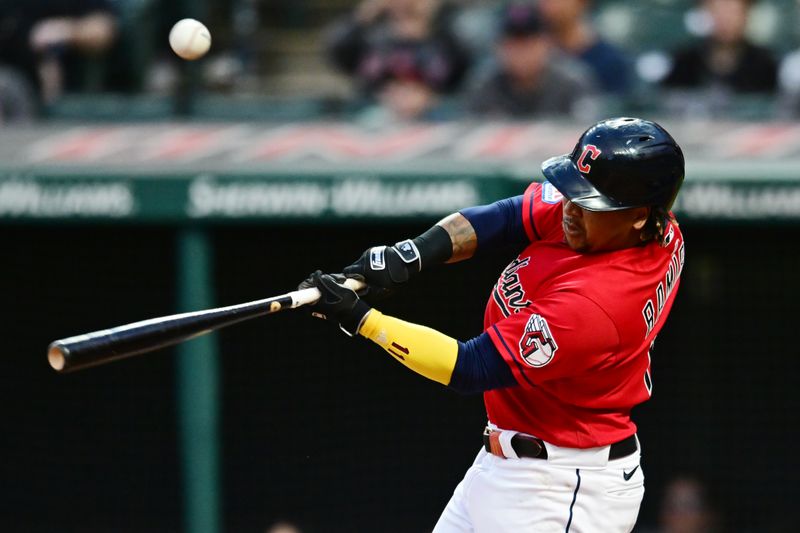 Sep 16, 2023; Cleveland, Ohio, USA; Cleveland Guardians third baseman Jose Ramirez (11) hits a single during the fifth inning against the Texas Rangers at Progressive Field. Mandatory Credit: Ken Blaze-USA TODAY Sports