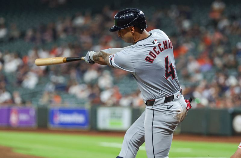 May 1, 2024; Houston, Texas, USA;  Cleveland Guardians shortstop Brayan Rocchio (4) hits a single during the third inning against the Houston Astros at Minute Maid Park. Mandatory Credit: Troy Taormina-USA TODAY Sports