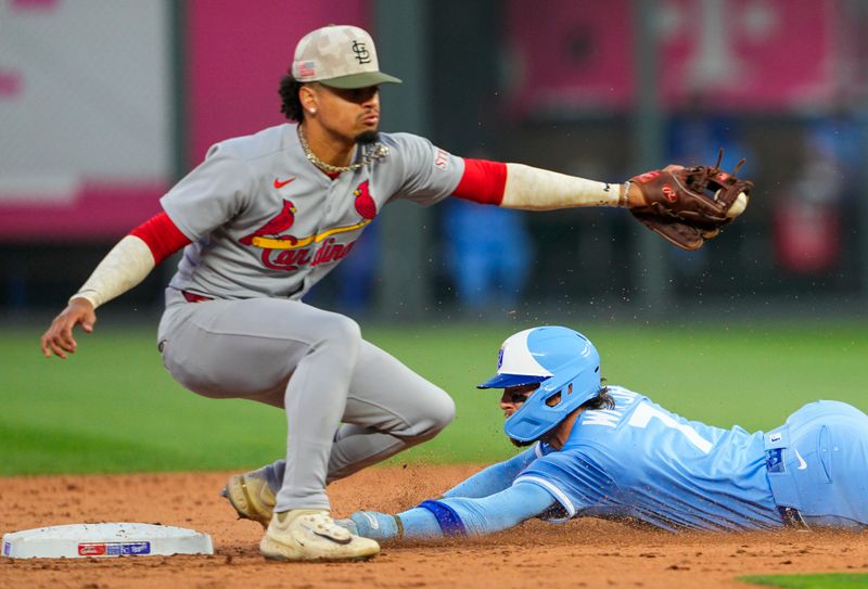 May 16, 2025; Kansas City, Missouri, USA; Kansas City Royals shortstop Bobby Witt Jr. (7) steals second base against St. Louis Cardinals shortstop Masyn Winn (0) during the fifth inning at Kauffman Stadium. Mandatory Credit: Jay Biggerstaff-Imagn Images