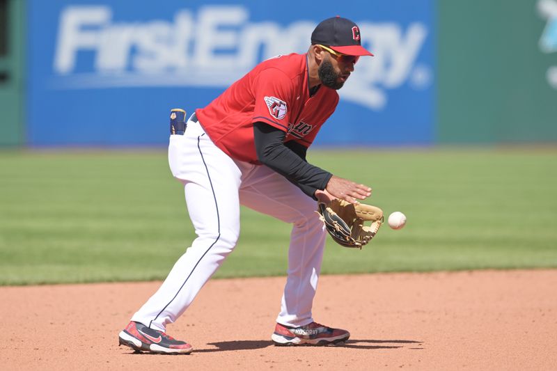 Apr 26, 2023; Cleveland, Ohio, USA; Cleveland Guardians shortstop Amed Rosario (1) fields a ground ball hit by Colorado Rockies right fielder Kris Bryant (not pictured) during the eighth inning at Progressive Field. Mandatory Credit: Ken Blaze-USA TODAY Sports