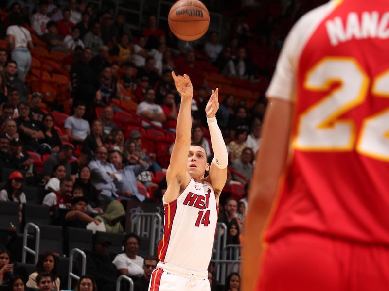 MIAMI, FL - OCTOBER 16: Tyler Herro #14 of the Miami Heat shots a three point basket at the game against the Atlanta Hawks on October 16, 2024 at Miami-Dade Arena in Miami, Florida. NOTE TO USER: User expressly acknowledges and agrees that, by downloading and or using this Photograph, user is consenting to the terms and conditions of the Getty Images License Agreement. Mandatory Copyright Notice: Copyright 2024 NBAE (Photo by Issac Baldizon/NBAE via Getty Images)