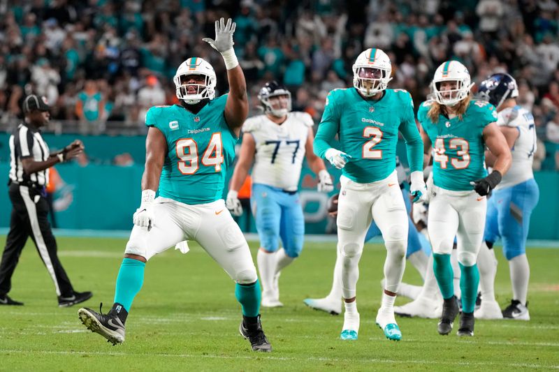 Miami Dolphins defensive tackle Christian Wilkins (94) celebrates after sacking Tennessee Titans quarterback Will Levis (8) during an NFL football game, Monday, Dec. 11, 2023, in Miami Gardens, Fla. (AP Photo/Doug Benc)