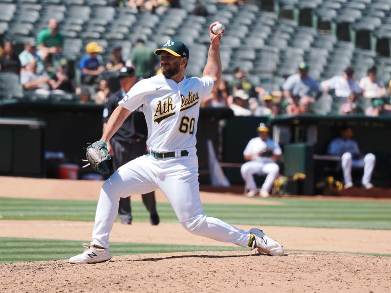 Jul 23, 2023; Oakland, California, USA; Oakland Athletics relief pitcher Sam Moll (60) pitches the ball against the Houston Astors during the seventh inning at Oakland-Alameda County Coliseum. Mandatory Credit: Kelley L Cox-USA TODAY Sports