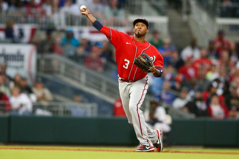 Apr 11, 2022; Atlanta, Georgia, USA; Washington Nationals shortstop Alcides Escobar (3) throws a runner out at first base against the Atlanta Braves in the second inning at Truist Park. Mandatory Credit: Brett Davis-USA TODAY Sports