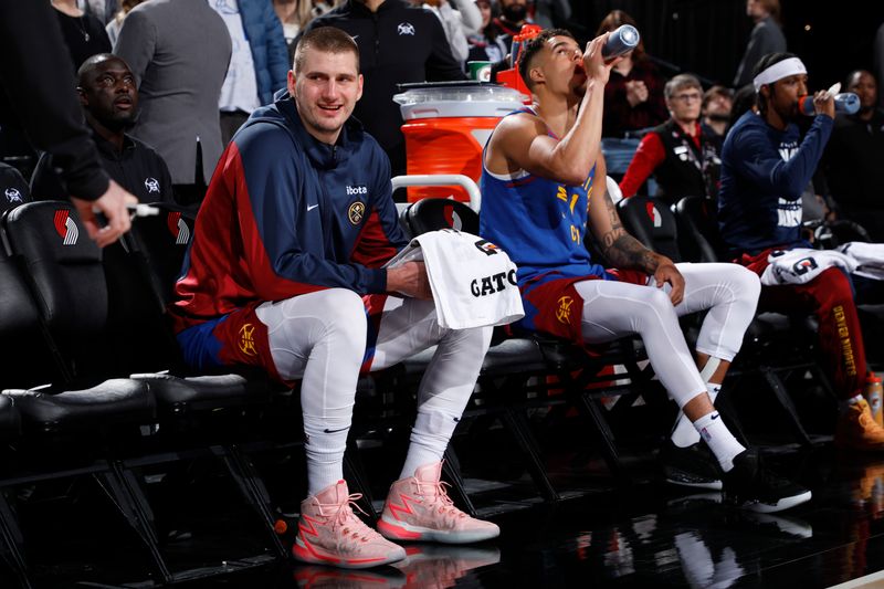 PORTLAND, OR - FEBRUARY 23: Nikola Jokic #15 of the Denver Nuggets smiles before the game against the Portland Trail Blazers on February 23, 2024 at the Moda Center Arena in Portland, Oregon. NOTE TO USER: User expressly acknowledges and agrees that, by downloading and or using this photograph, user is consenting to the terms and conditions of the Getty Images License Agreement. Mandatory Copyright Notice: Copyright 2024 NBAE (Photo by Cameron Browne/NBAE via Getty Images)