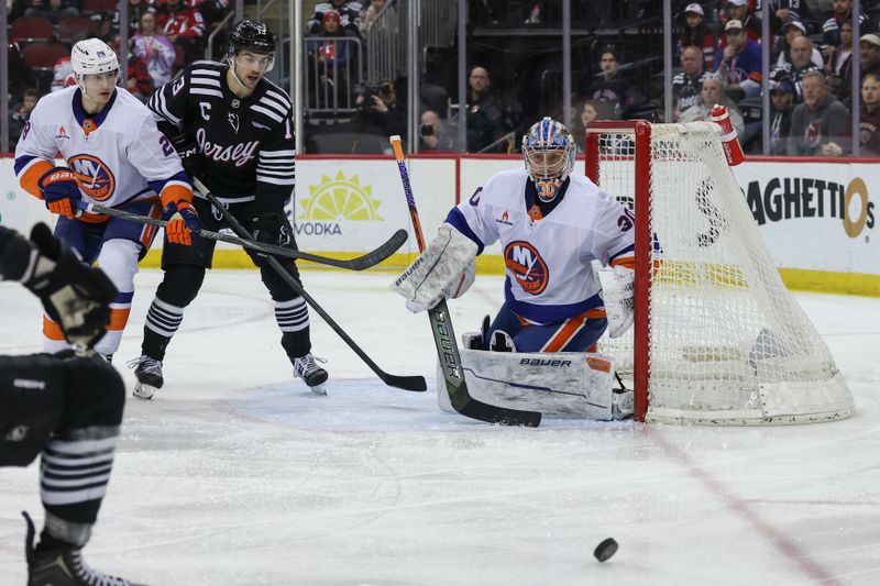 Apr 13, 2025; Newark, New Jersey, USA; New York Islanders goaltender Ilya Sorokin (30) defends his net against the New Jersey Devils during the second period at Prudential Center. Mandatory Credit: Ed Mulholland-Imagn Images
